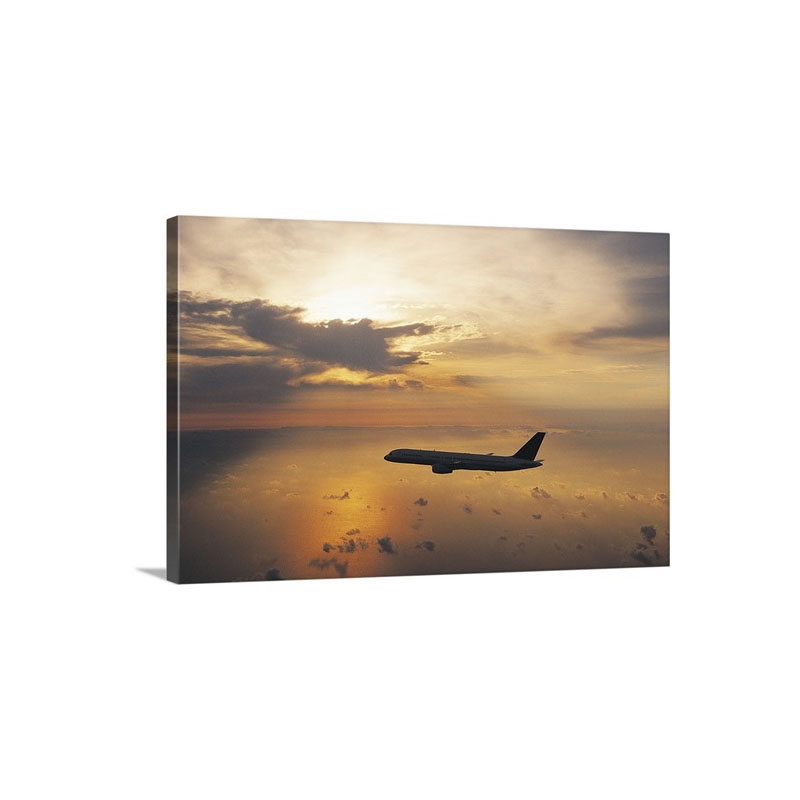 Commercial Aeroplane Flying Above The Sea At Dusk Wall Art - Canvas - Gallery Wrap