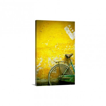 A Bike Leaning Against A Wall Hanoi Vietnam Wall Art - Canvas - Gallery Wrap