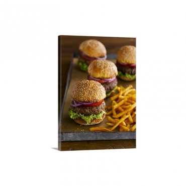 A Tray Of Hamburgers On Sesame Seed Buns With French Fries Wall Art - Canvas - Gallery Wrap