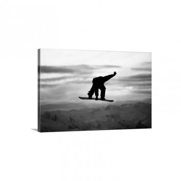 A Male Snowboarder Does A Backside 180 Mute Grab Wall Art - Canvas - Gallery Wrap