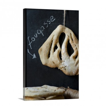 A Single Fougasse Bread Hanging With A Sign Written In Chalk Behind Wall Art - Canvas - Gallery Wrap