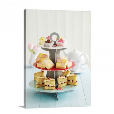 A Tiered Cake Stand With Petit Fours Battenburg Cake And Victoria Sponge Cake Wall Art - Canvas - Gallery Wrap