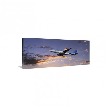 An Airplane In Flight Wall Art - Canvas - Gallery Wrap