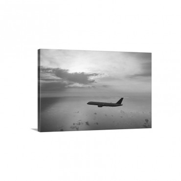 Commercial Aeroplane Flying Above The Sea At Dusk Wall Art - Canvas - Gallery Wrap