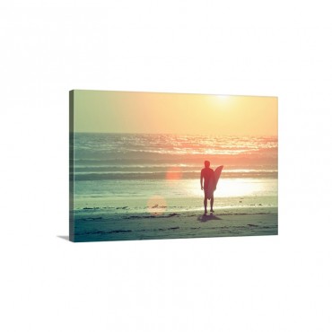 Surfer Stands By Shore As Sun Goes Down Wall Art - Canvas - Gallery Wrap