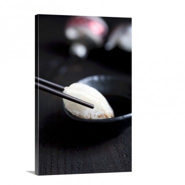 Sushi With Squid Being Dipped In Soy Sauce Wall Art - Canvas - Gallery Wrap
