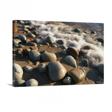 Water Washes Up On Smooth Stones Lining A Beach Lake Superior Ontario Canada Wall Art - Canvas - Gallery Wrap
